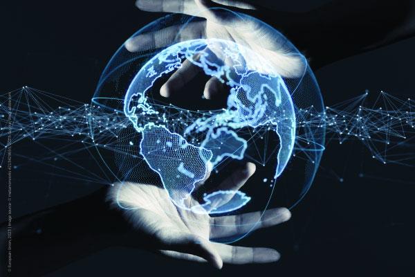 Photo of a hand holding the globe